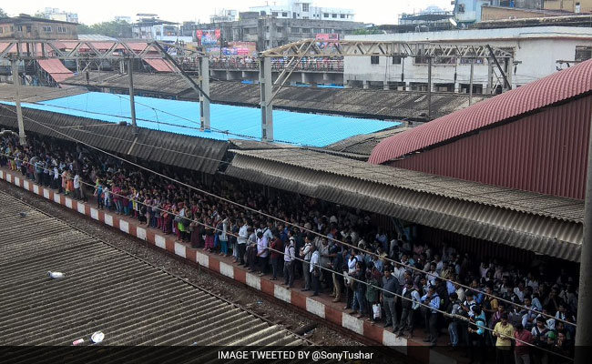 Snag Delays Local Trains In Mumbai, People Walk Along Tracks To Reach Office