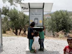 Sun-Powered Phone Charger Gives Migrants In Greece Free Electricity