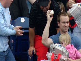 Baseball Fan's Brilliant One-Handed Catch While Holding Daughter is Viral Baseball Fan's Brilliant One-Handed Catch While Holding Daughter is Viral