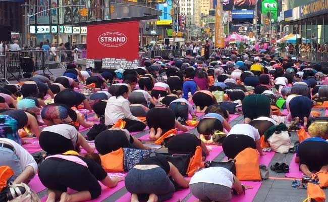 Thousands Of Yogis Hit Times Square To Welcome Summer