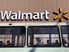 Wal-Mart Draws More Shoppers, Raises Fiscal-Year Outlook
