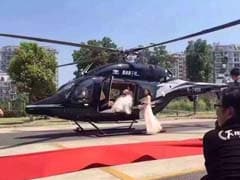 Bride and Groom Hold Up Traffic to Board Helicopter on Busy Road