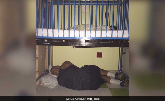 The Story Behind This Viral Pic of Dad Sleeping Under Sick Child's Bed