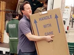 The Real Story Behind Viral Pic of David Cameron Moving House