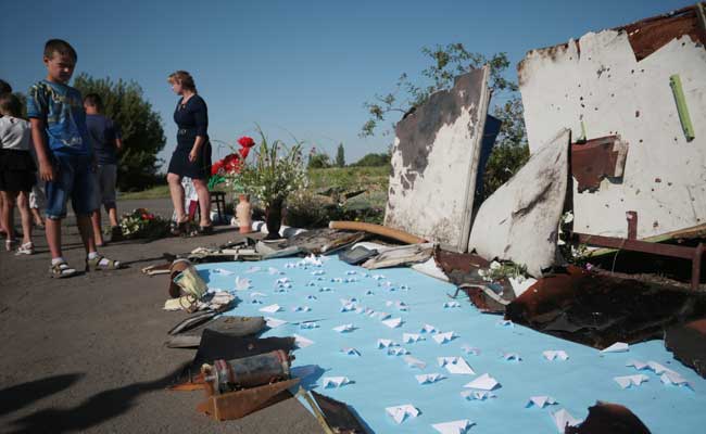 Two Years On, Ukraine Villagers Mourn At MH17 Crash Site