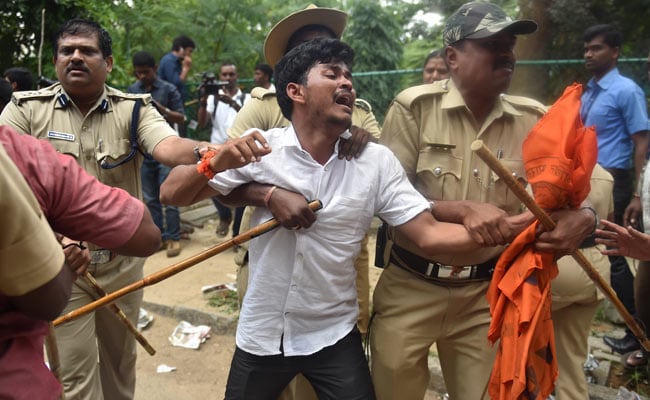 Police Cane ABVP Activists At Amnesty Office In Bengaluru