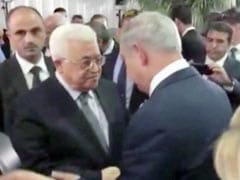 Palestinian President, Israeli Prime Minister Shake Hands At Peres Funeral