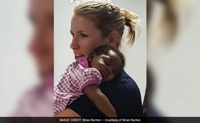 This Photo Of An Officer Comforting A Baby Went Viral. But There's More To The Story.