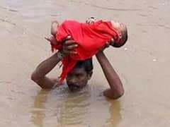 Just Like <i>Baahubali</i>, This Photo Of Andhra Dad Carrying Sick Baby