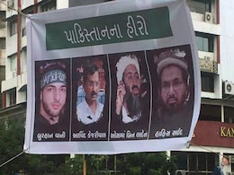 Arvind Kejriwal Attacks BJP After Featuring On Gujarat Posters With Osama Bin Laden Arvind Kejriwal Attacks BJP After Featuring On Gujarat Posters With Osama Bin Laden