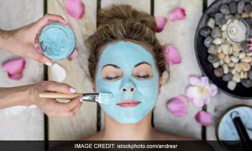 face mask girl applying face pack