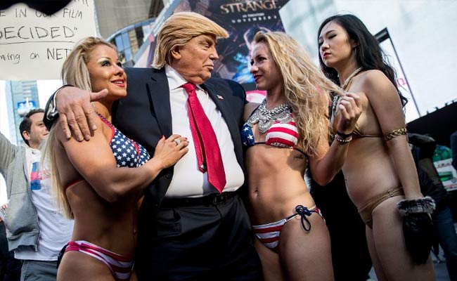 Bikini-Clad Models Surround Fake Donald Trump In New York City Stunt