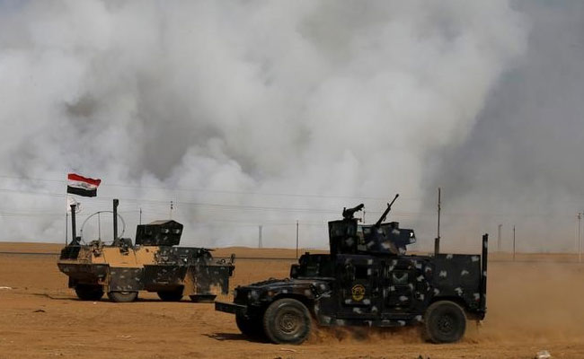 US Troops At Iraq Base Use Protective Masks Over Burning Sulphur