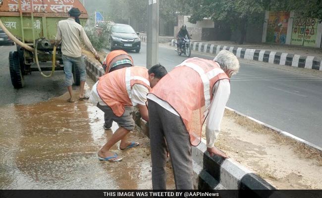 Public Works Department Sprinkles Water On Roads To Reduce Dust Pollution