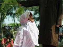 Indonesian Woman Screams As Crowd Cheers During Caning At Mosque