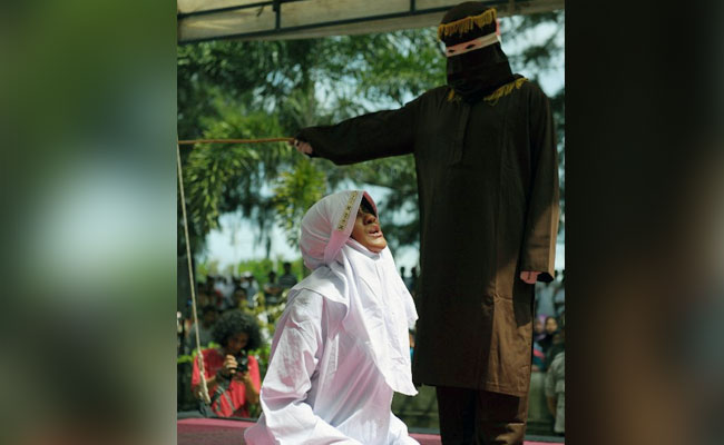 Indonesian Woman Screams As Crowd Cheers During Caning At Mosque