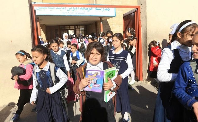 Iraqi Children Dump ISIS's Books Of Violence, Return To School