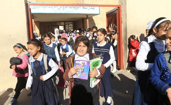 Iraqi Children Dump ISIS's Books Of Violence, Return To School