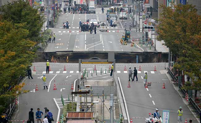 Giant Sinkhole. How Giant? It's Sucking Up A 5-Lane Road