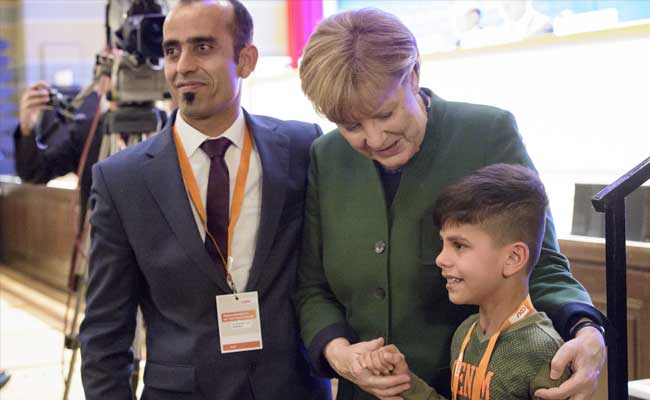 German Chancellor Angela Merkel Thanked By Afghan Boy At Party Meeting