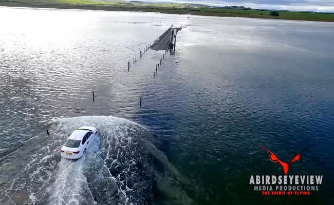 Dramatic Drone Footage Captures Uber Racing Rising Tide On Causeway
