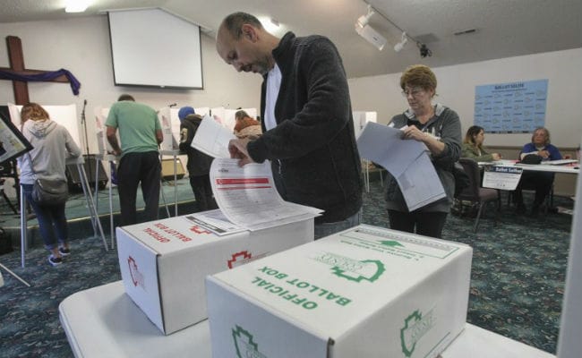 US Election: Voters Report Long Lines, Intimidation And Confusion