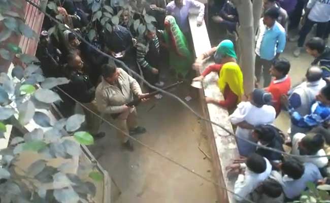 In Video Outside Western UP Bank, Cop Fires In Air, Takes Aim At Those Assaulting Him