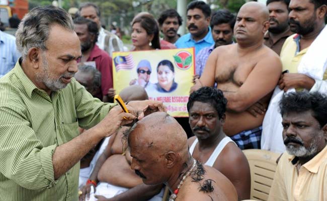 AIADMK Members Shaved Heads At Jayalalithaa Burial Site