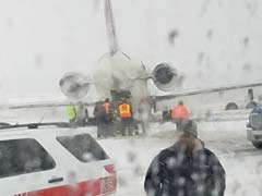 Plane With 70 On Board Skids On Snowy Grass In US