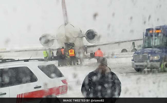 Plane With 70 On Board Skids On Snowy Grass In US