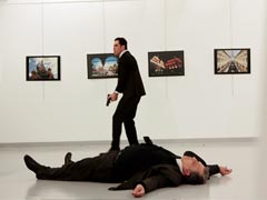 Killer Of Russian Envoy 'Used Police ID' To Enter Ankara Show