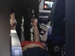Watch How A Woman Was Dragged Out Of Plane