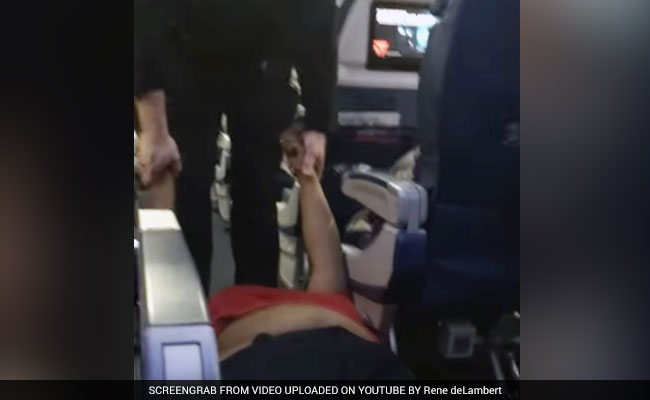 Watch How A Woman Was Dragged Out Of Plane