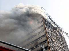 Dozens Of Iran Firefighters Feared Trapped In Building Collapse