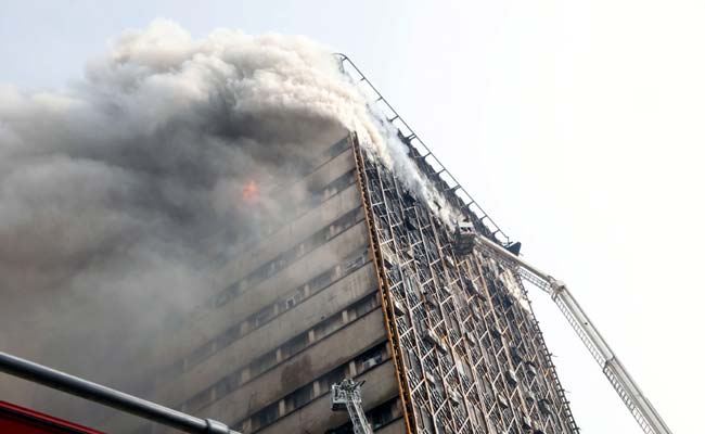 Dozens Of Iran Firefighters Feared Trapped In Building Collapse