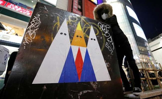 Japanese Artist Attacks US President Donald Trump In Sticker Graffiti