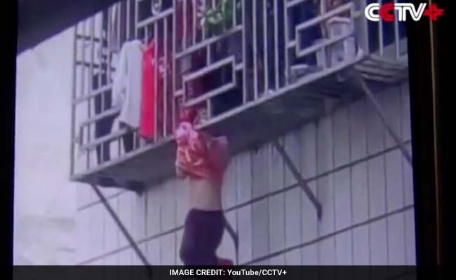 Watch: Two Men Save Girl Dangling From 4th Floor Window In Shocking Video