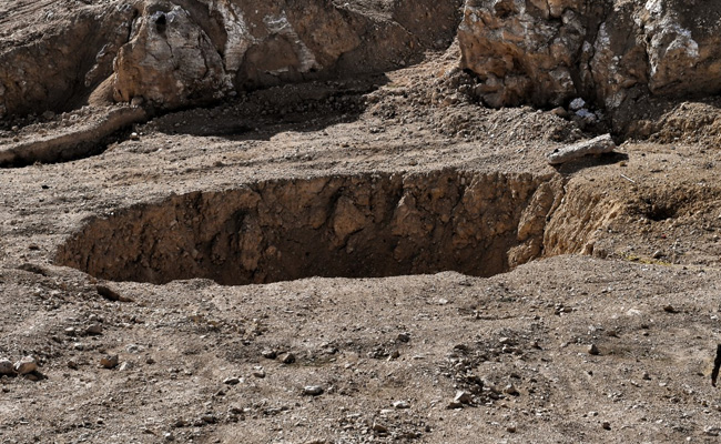 In Iraq's Desert, Mass Grave Horror Beneath The Dirt