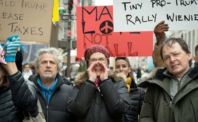 Hundreds March Against Donald Trump Ahead Of New York Visit