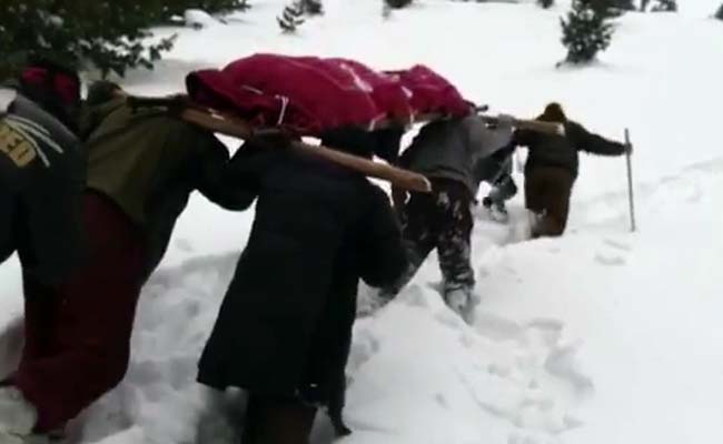 soldier carries mothers dead body