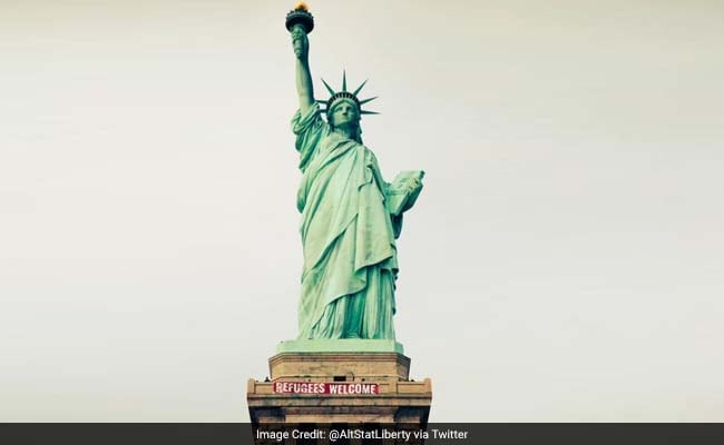 Banner 'Refugees Welcome' Unfurled At Statue Of Liberty