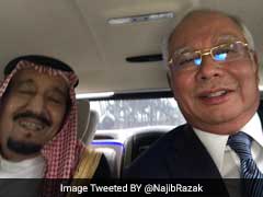 Saudi King Salman Embraces 'Selfie' On Tour Across Asia