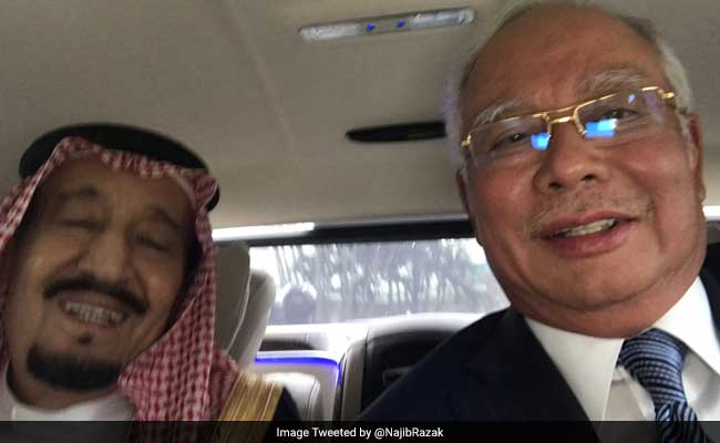 Saudi King Salman Embraces 'Selfie' On Tour Across Asia