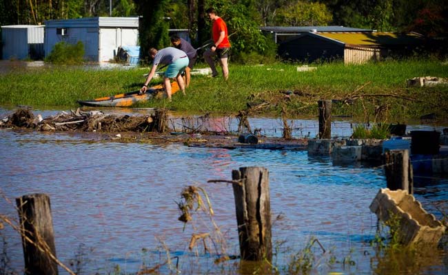 Australia Floodwaters Still Rising, Police Search For Missing