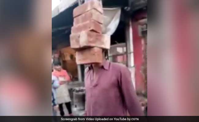 Look Ma, No Hands! Man Lifts 6 Bricks With His Teeth In Amazing Video