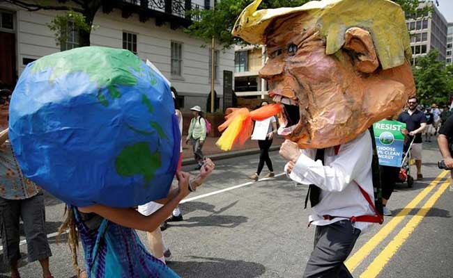 As Donald Trump Celebrates 100 Days In Office, Sea Of Climate Protesters Gather Outside White House