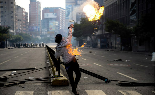 Venezuela Protesters Bring 'Poo Bombs' To Hurl At Cops