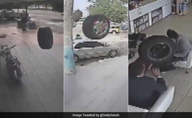 Caught On Camera: Tyre Falls Off Moving Car, Enters Store, Hits Two Men
