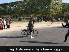 'Rude' Arnold Schwarzenegger Photobombs Tourists In Front Of Eiffel Tower