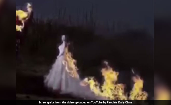 bride sets wedding gown on fire china